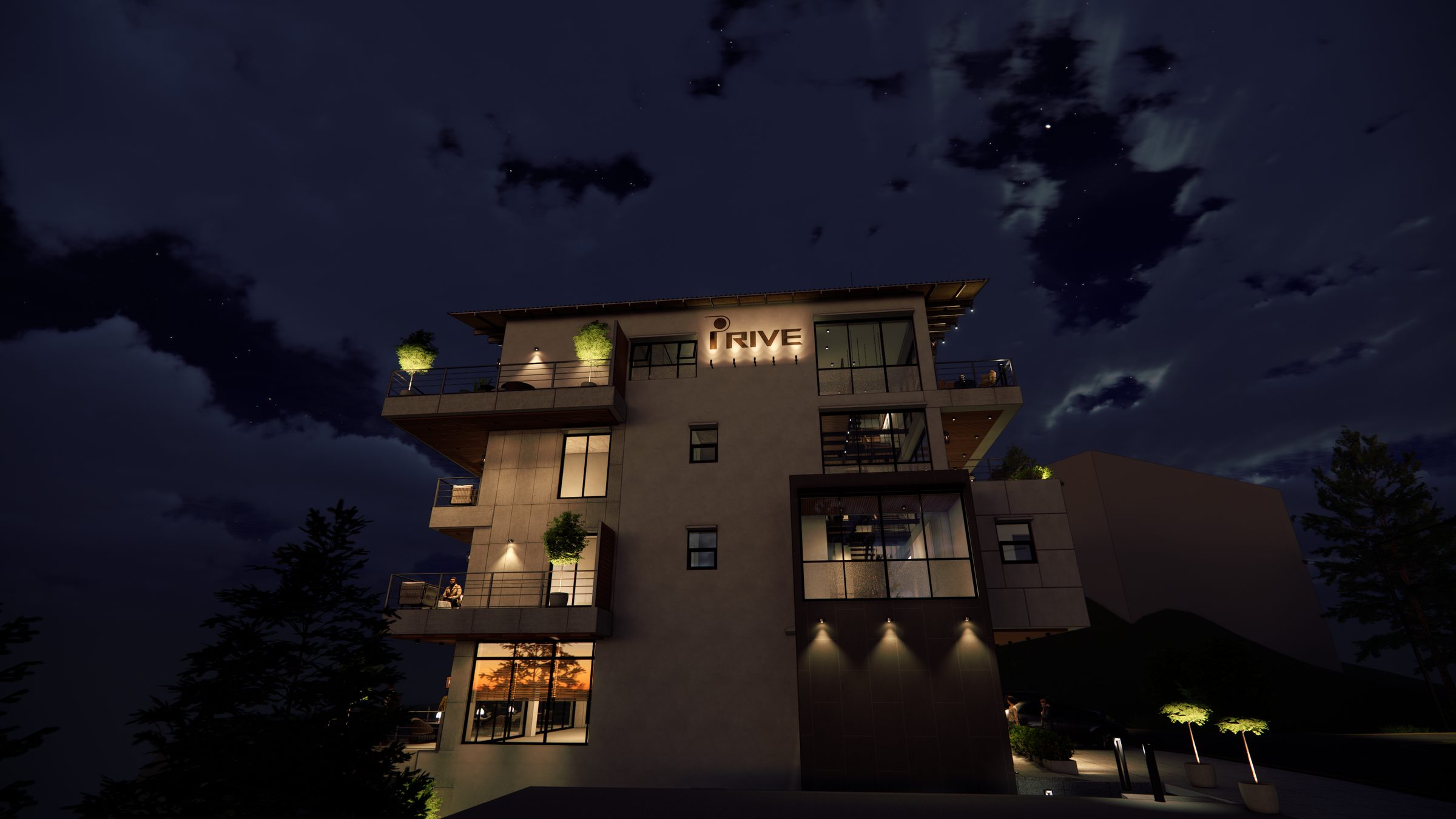 The building lit at night from below