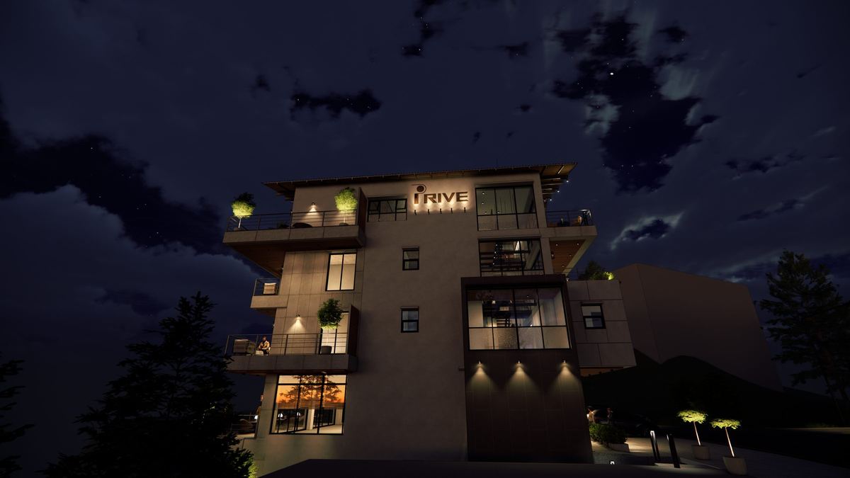 The building lit at night from below