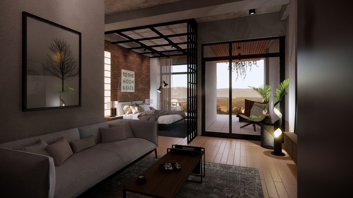 Living area open to the bed and the terrace beyond